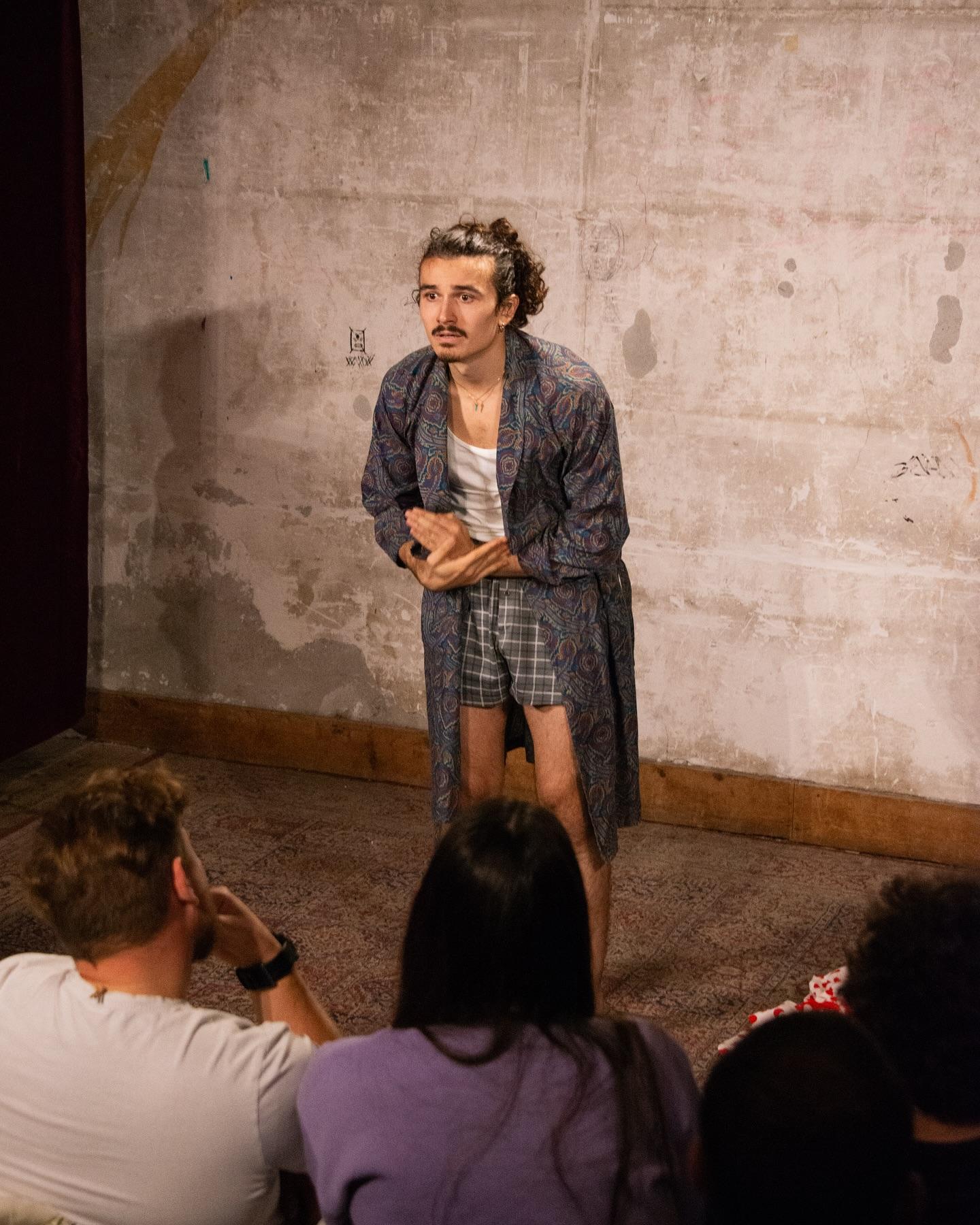 Matteo Maringola performing before a seated audience